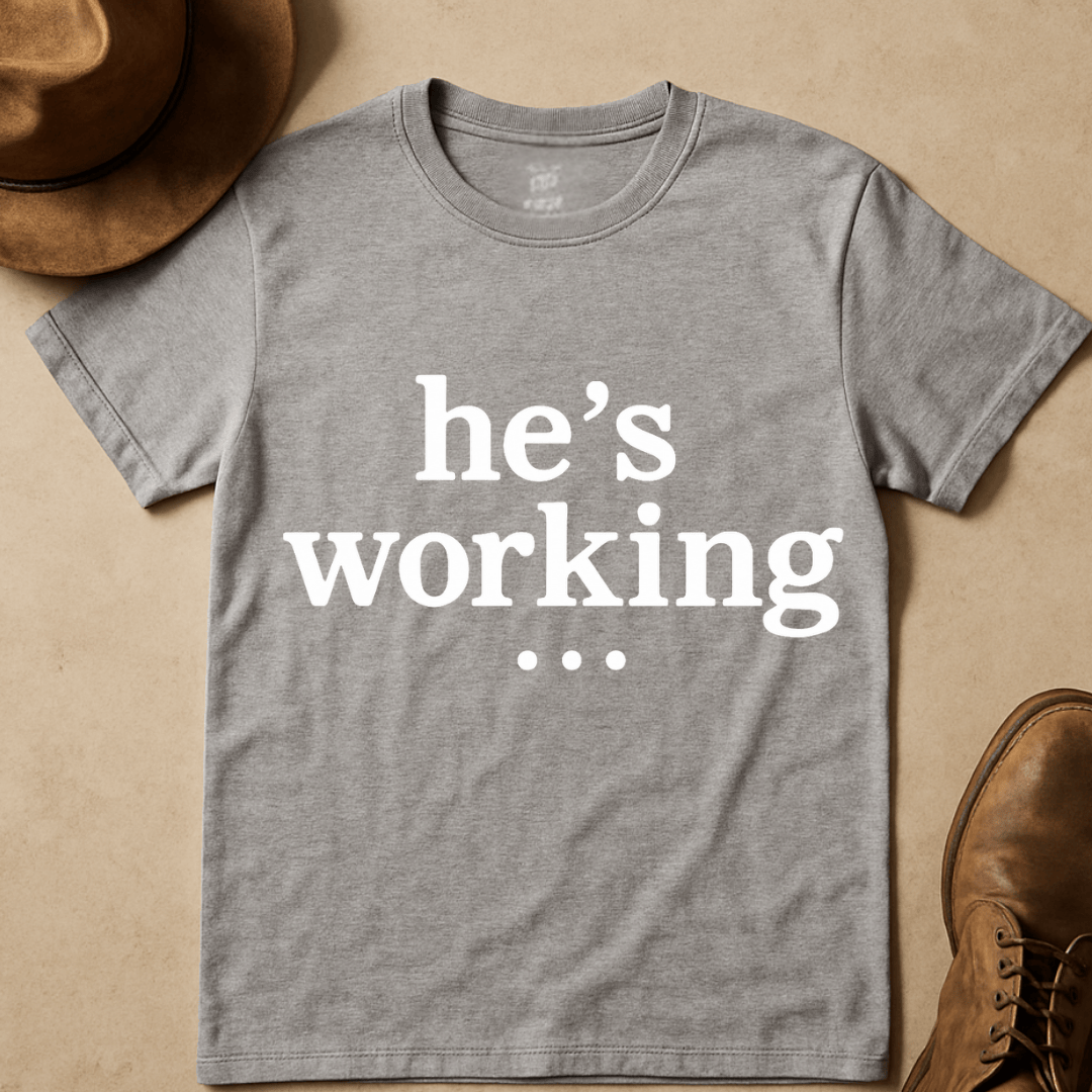 HE'S WORKING... T-SHIRT